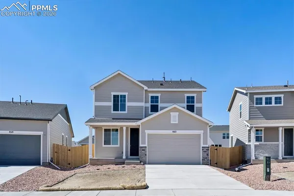 a front view of a house with garage