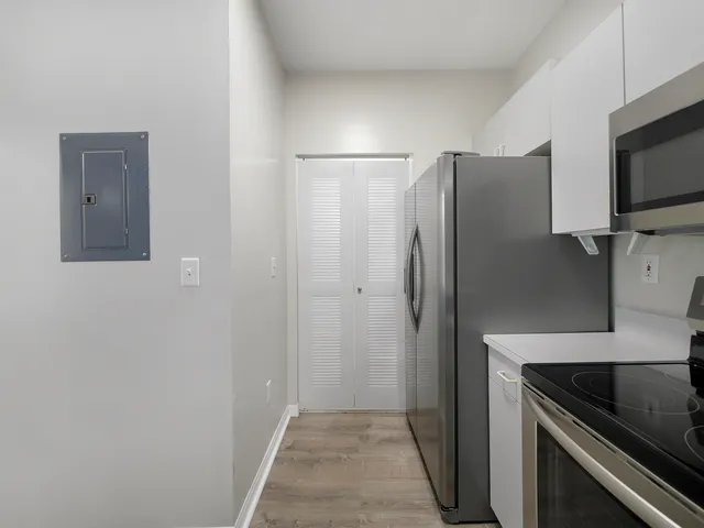 a view of a kitchen from the hallway