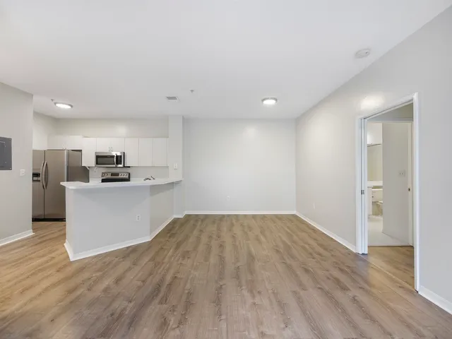 a view of kitchen with wooden floor