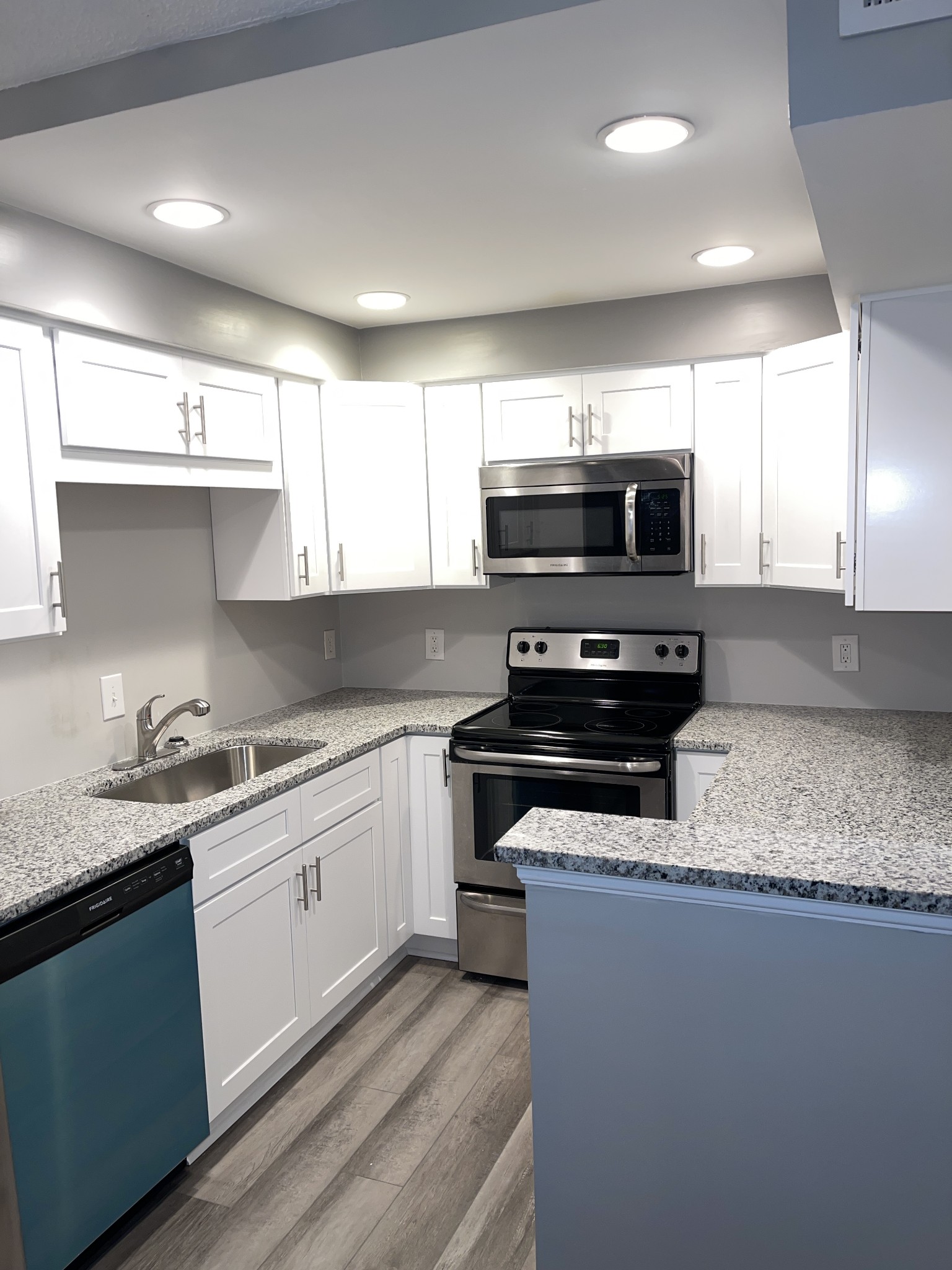 500 Paragon Mills Road, Unit N7 Nashville, TN 37211 - Photo 10 of 21 a kitchen with stainless steel appliances and a sink
