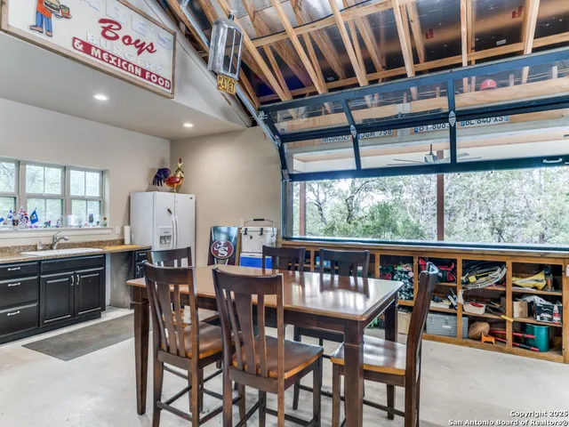 a view of a dining room with furniture window and outside view