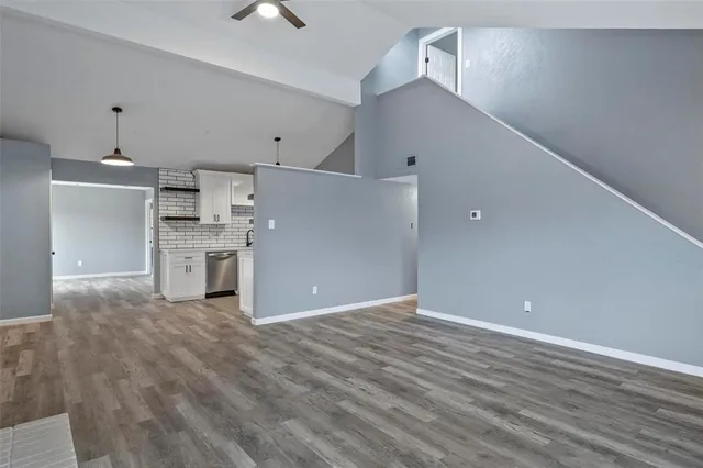 a view of a kitchen with a sink and a stove top oven