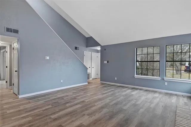 a view of an empty room with a window