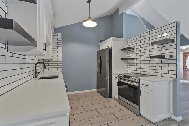 a kitchen with a stove and a microwave