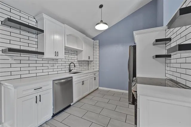 a spacious bathroom with a shower sink and mirror