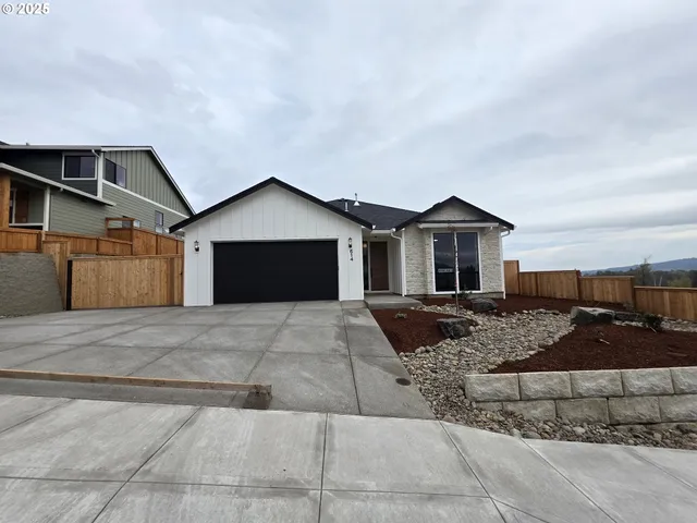 a front view of a house with yard