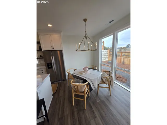 a kitchen with a sink cabinets and a window