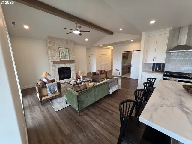 a living room with a fireplace and a rug