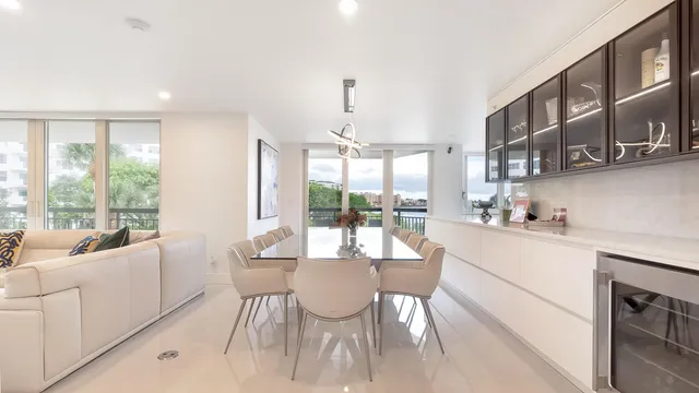 a large kitchen with a table and chairs