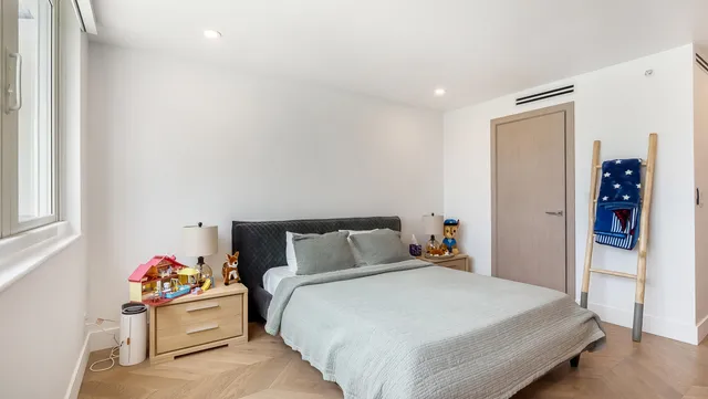 a bedroom with a bed and closet