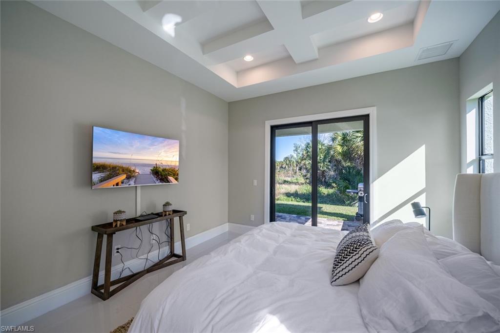 522 19th Street Northwest Naples, FL 34120 - Photo 23 of 33 a bedroom with furniture and a window