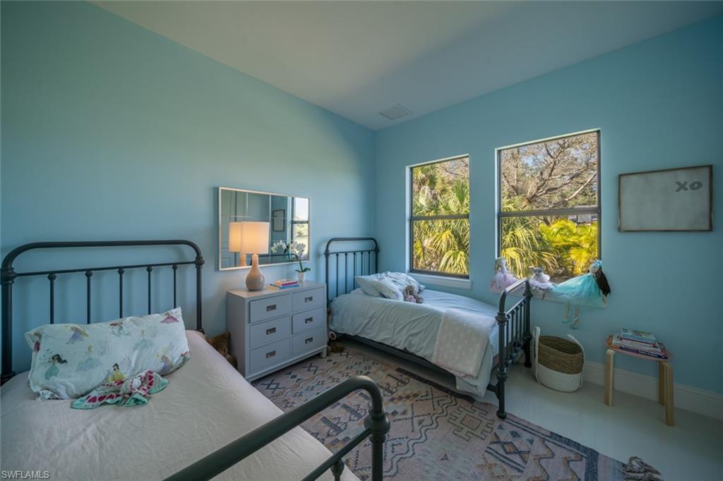 522 19th Street Northwest Naples, FL 34120 - Photo 27 of 33 a bedroom with a bed and a window