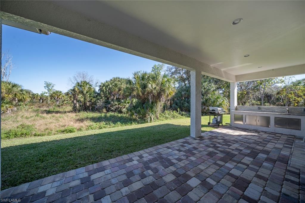 522 19th Street Northwest Naples, FL 34120 - Photo 31 of 33 a view of a porch with a yard
