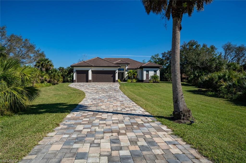 522 19th Street Northwest Naples, FL 34120 - Photo 4 of 33 a view of a house with a yard
