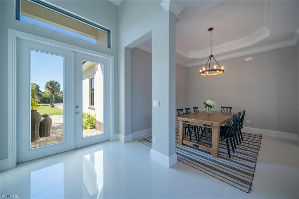 522 19th Street Northwest Naples, FL 34120 - Photo 8 of 33 a view of a dining room with furniture and window