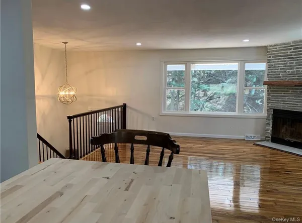 a view of a living room and a floor to ceiling window