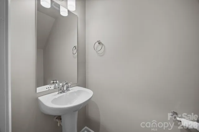 a bathroom with a sink and mirror