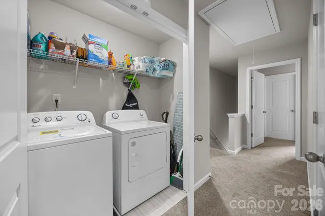 a bedroom with a bed tv and a window