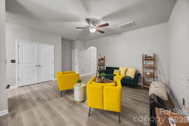 a living room with furniture and a table