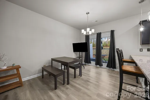 a view of a livingroom with furniture and a flat screen tv