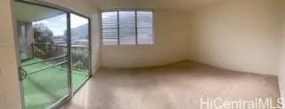a view of empty room with floor to ceiling window