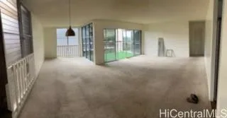 a view of empty room with floor to ceiling window