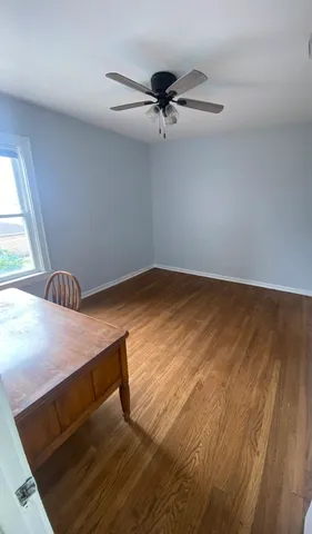 a view of room with window and ceiling fan
