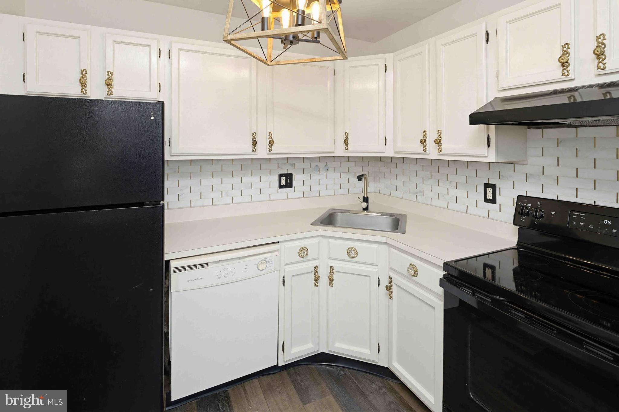 403 South Main Street, Unit S200 Doylestown, PA 18901 - Photo 12 of 26 a kitchen with a refrigerator and a stove