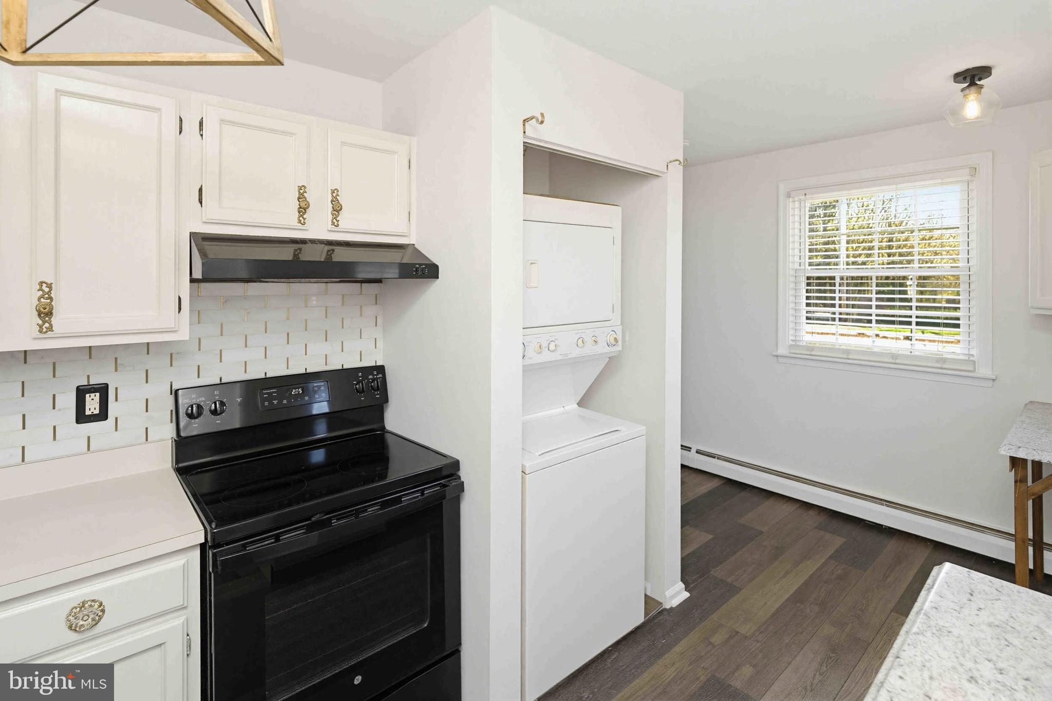 403 South Main Street, Unit S200 Doylestown, PA 18901 - Photo 13 of 26 a kitchen with stainless steel appliances a stove and white cabinets