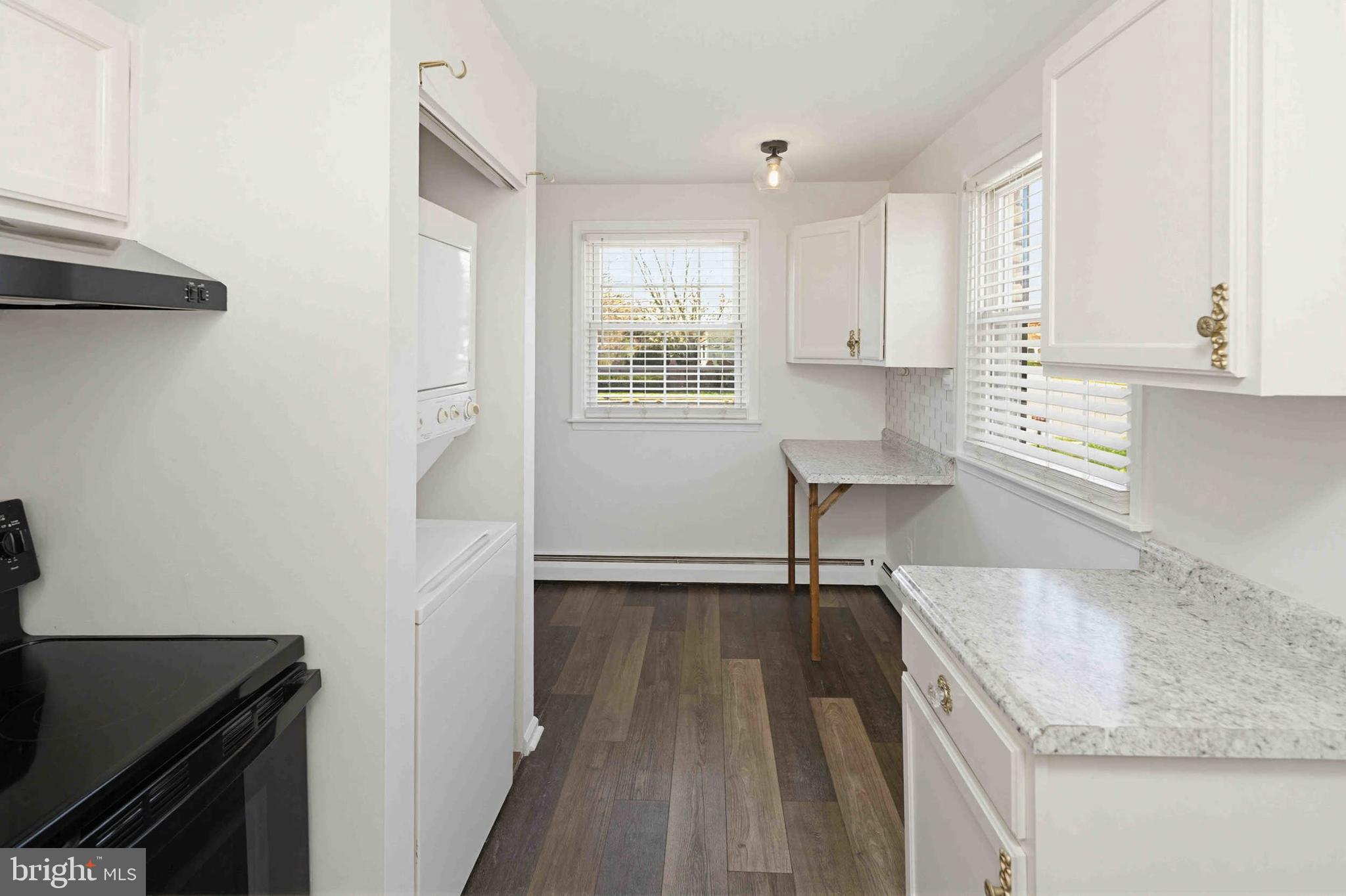 403 South Main Street, Unit S200 Doylestown, PA 18901 - Photo 15 of 26 a kitchen with granite countertop a sink stove and cabinets