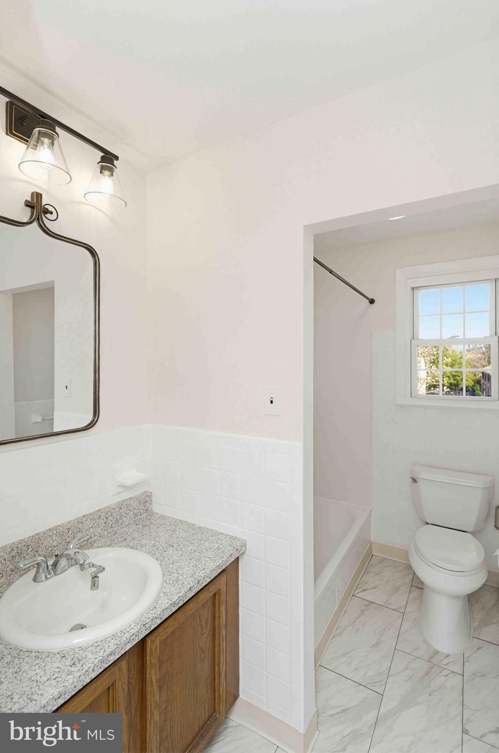 403 South Main Street, Unit S200 Doylestown, PA 18901 - Photo 16 of 26 a bathroom with a sink and a mirror