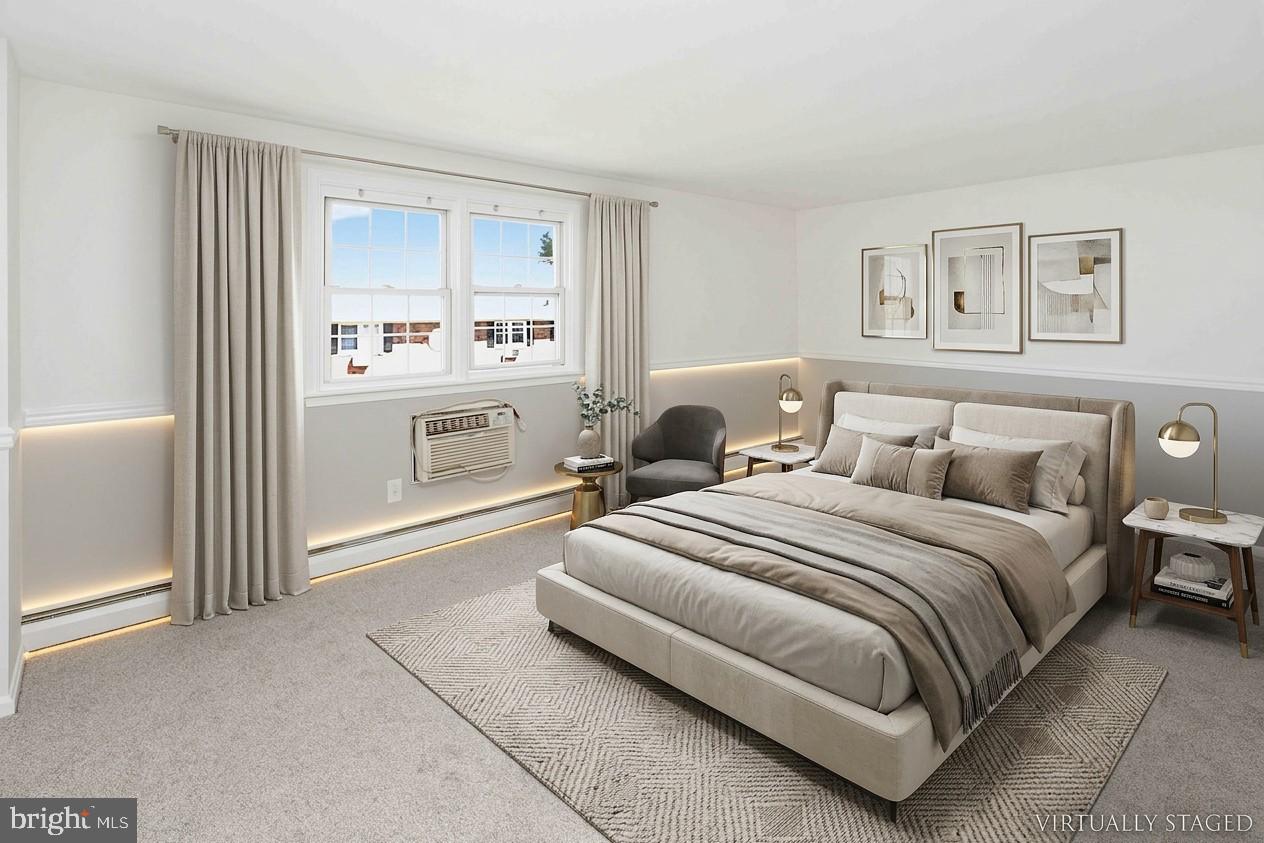 403 South Main Street, Unit S200 Doylestown, PA 18901 - Photo 19 of 26 a spacious bedroom with a bed and a window