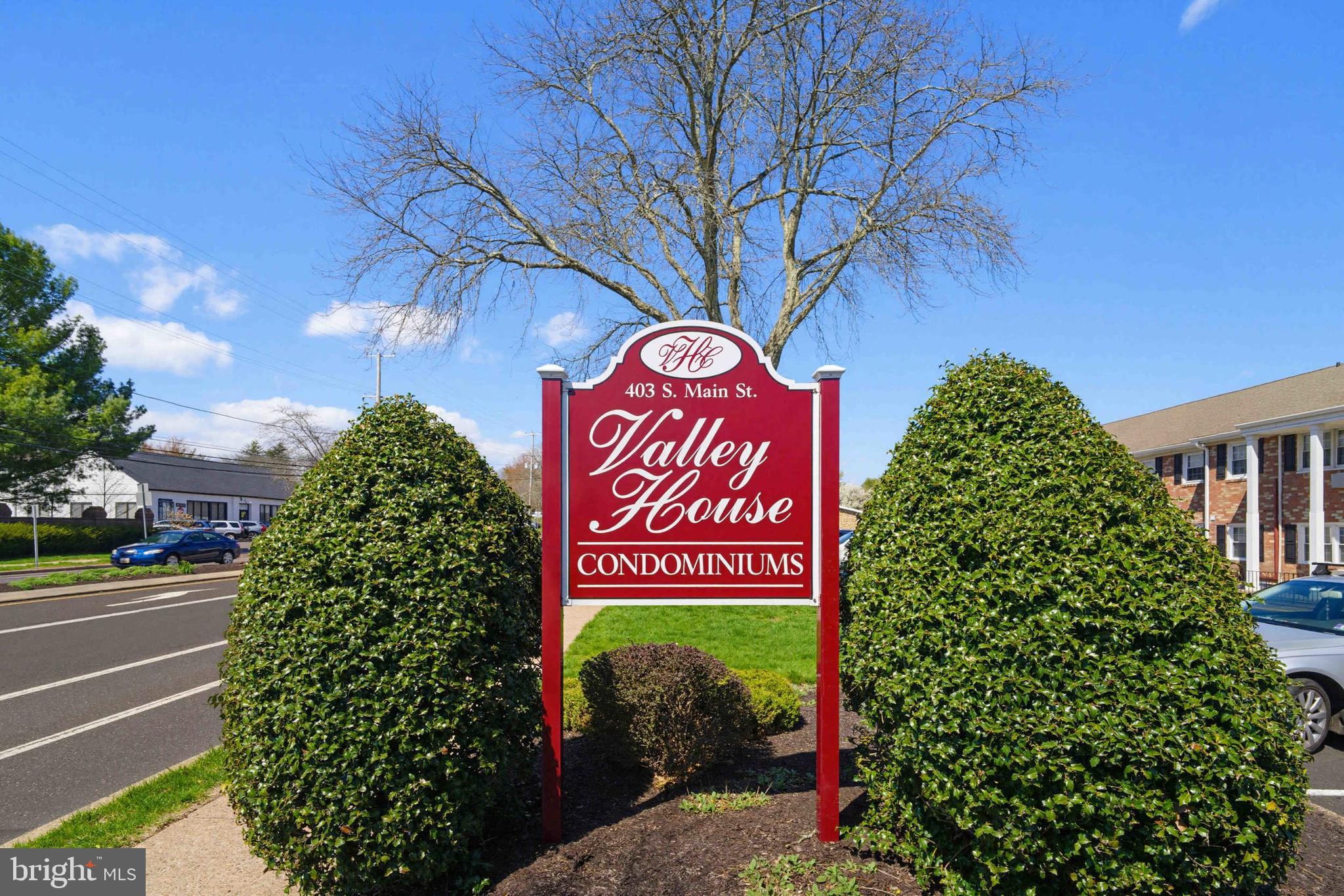 403 South Main Street, Unit S200 Doylestown, PA 18901 - Photo 2 of 26 a sign that is sitting on a brick wall