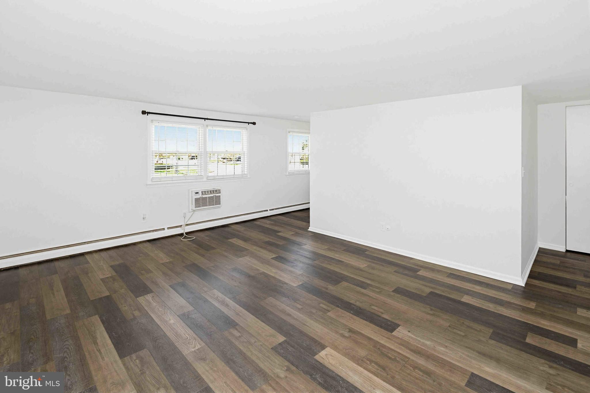403 South Main Street, Unit S200 Doylestown, PA 18901 - Photo 6 of 26 an empty room with wooden floor and windows