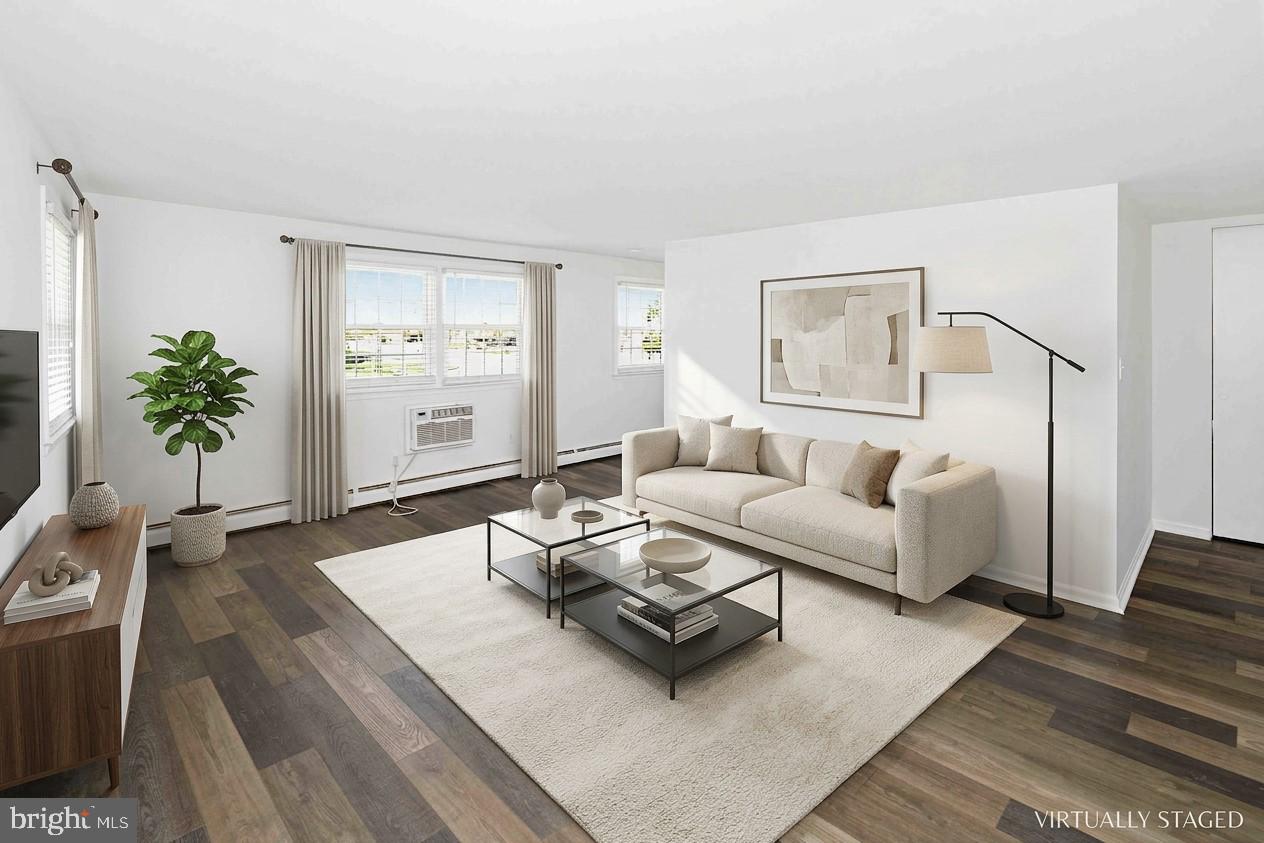 403 South Main Street, Unit S200 Doylestown, PA 18901 - Photo 7 of 26 a living room with furniture and wooden floor