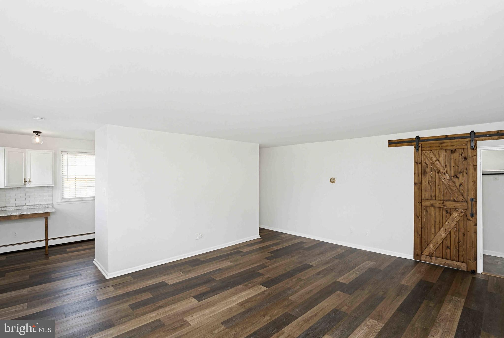 403 South Main Street, Unit S200 Doylestown, PA 18901 - Photo 8 of 26 an empty room with wooden floor