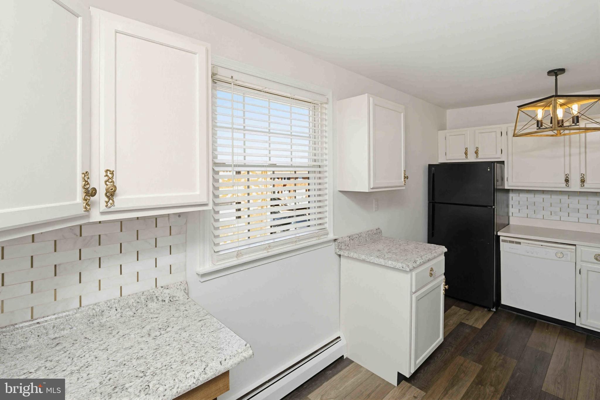 403 South Main Street, Unit S200 Doylestown, PA 18901 - Photo 10 of 26 a kitchen with a sink a refrigerator and window