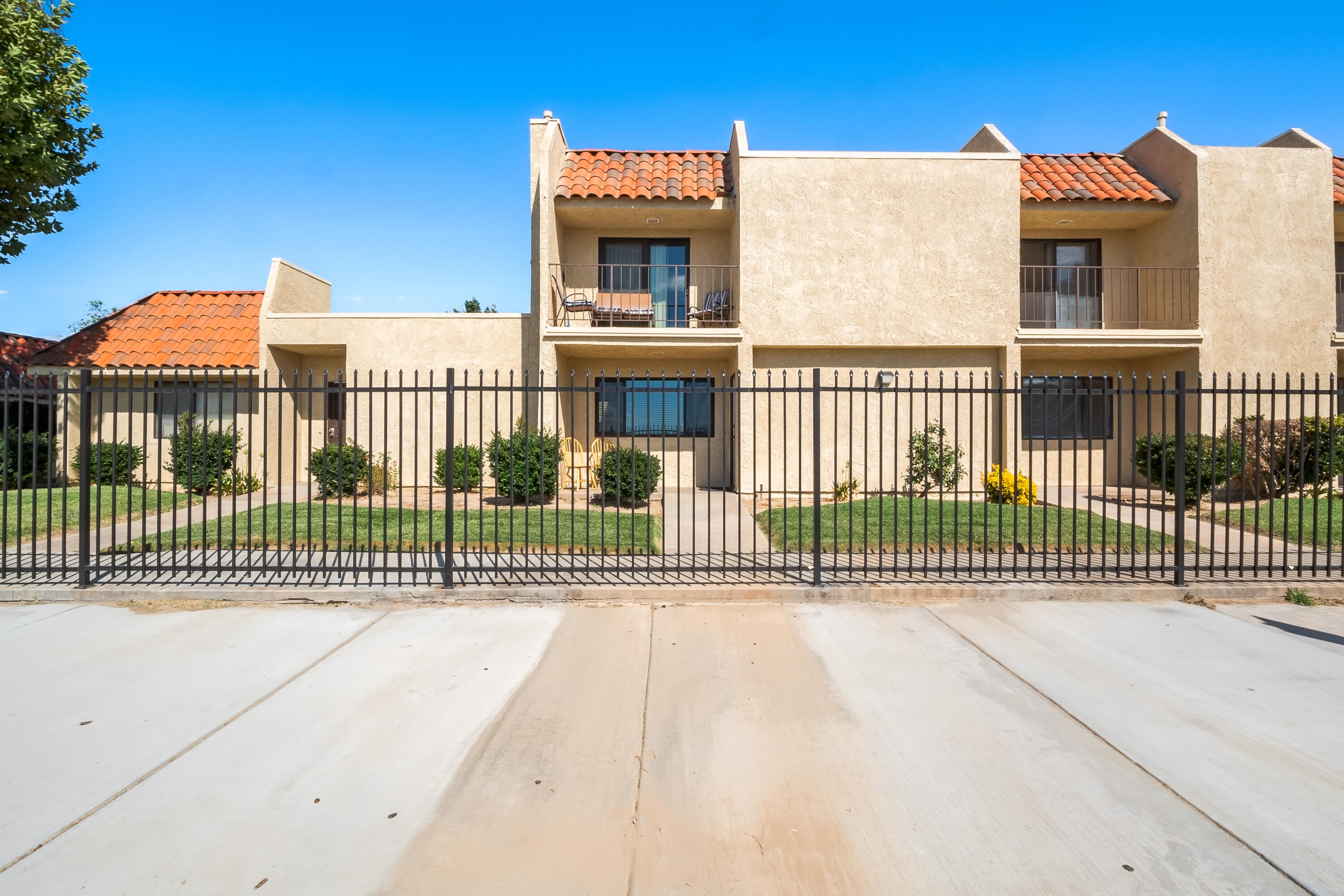 44200 Kingtree Avenue, Unit 24 Lancaster, CA 93534 - Photo 1 of 23 a view of a brick house with a small yard
