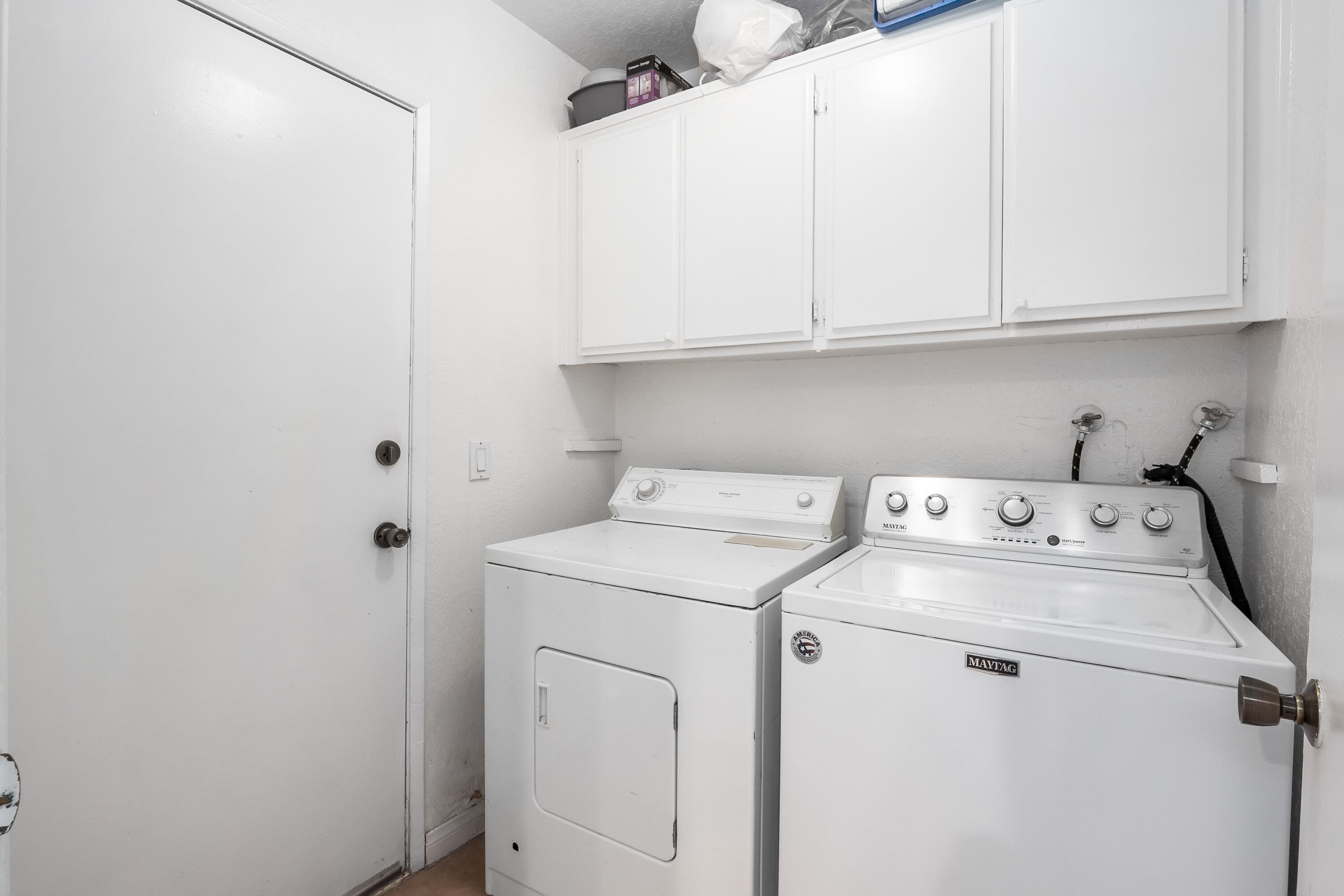 44200 Kingtree Avenue, Unit 24 Lancaster, CA 93534 - Photo 11 of 23 a view of storage and utility room with washer and dryer