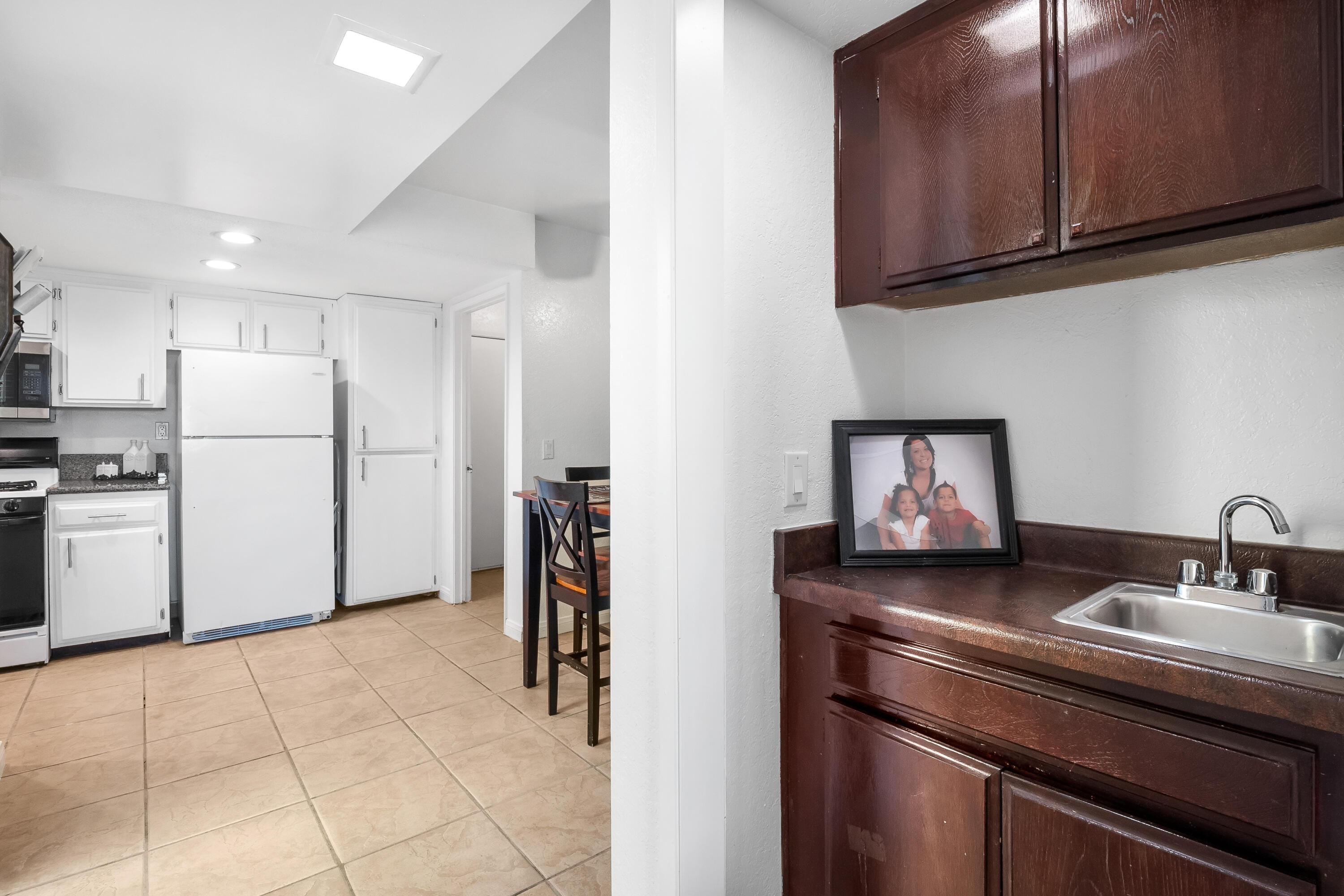 44200 Kingtree Avenue, Unit 24 Lancaster, CA 93534 - Photo 12 of 23 a kitchen with a sink appliances and cabinets