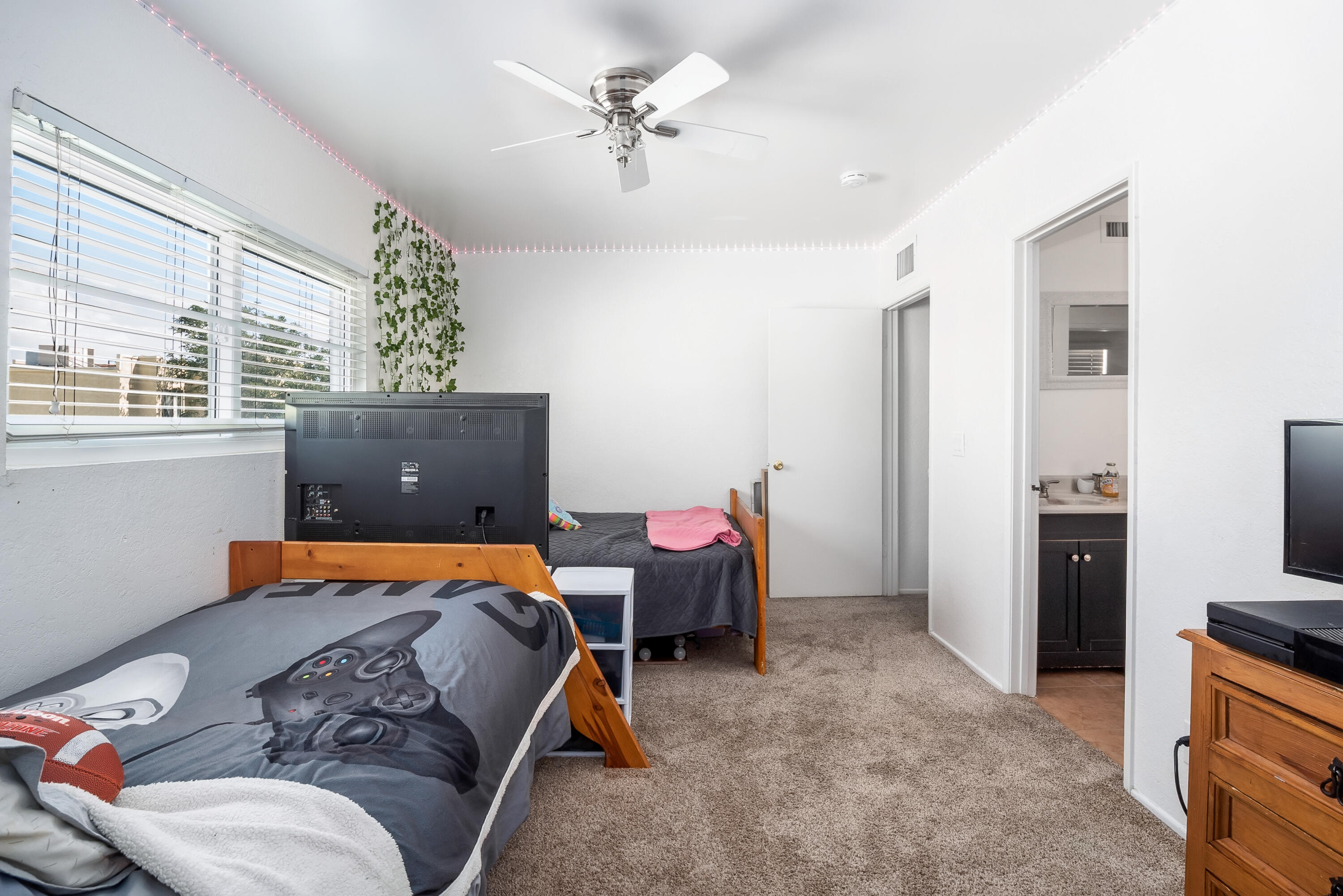 44200 Kingtree Avenue, Unit 24 Lancaster, CA 93534 - Photo 15 of 23 a bedroom with furniture and a window