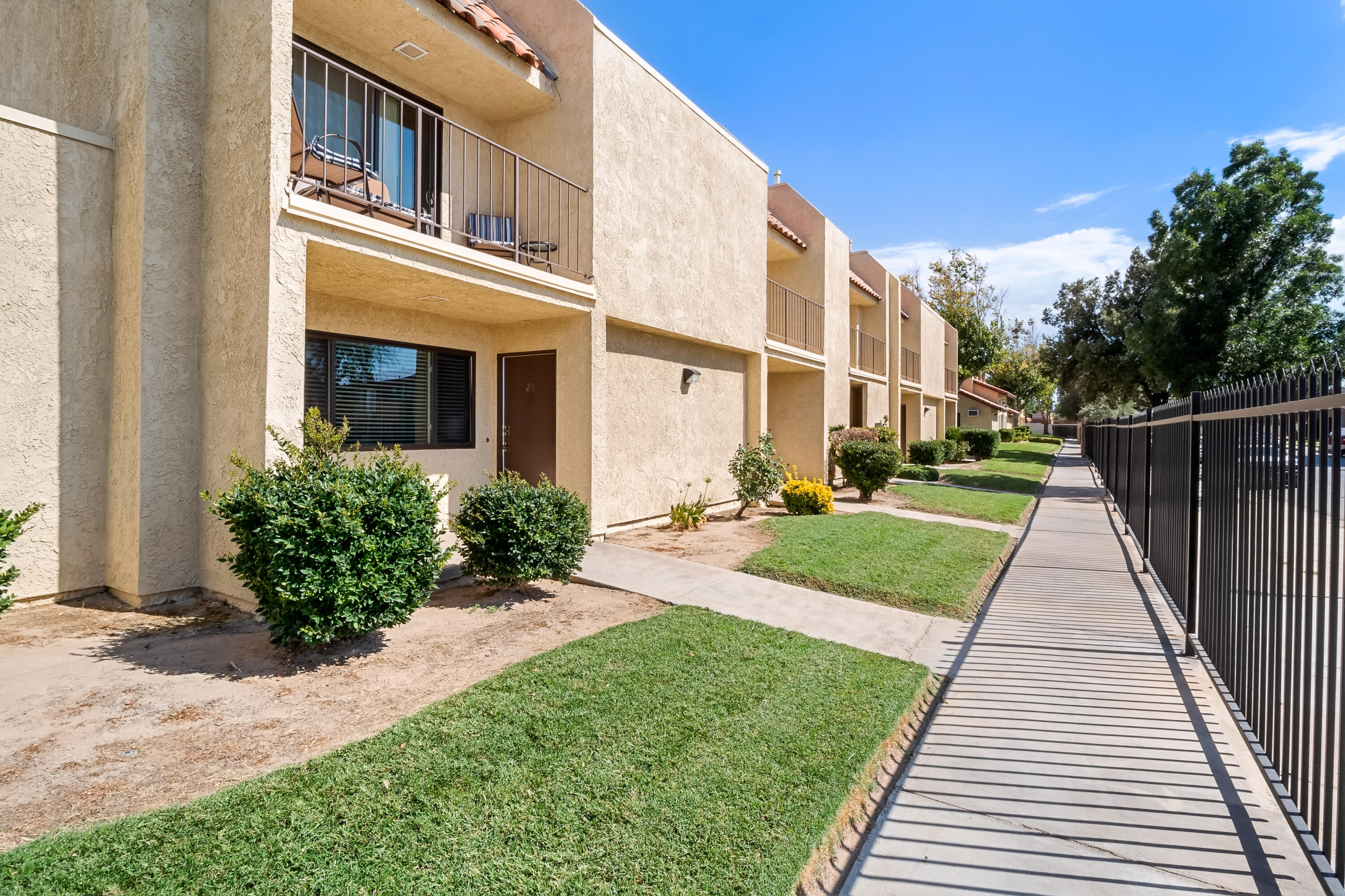 44200 Kingtree Avenue, Unit 24 Lancaster, CA 93534 - Photo 2 of 23 a view of a garden with pathway