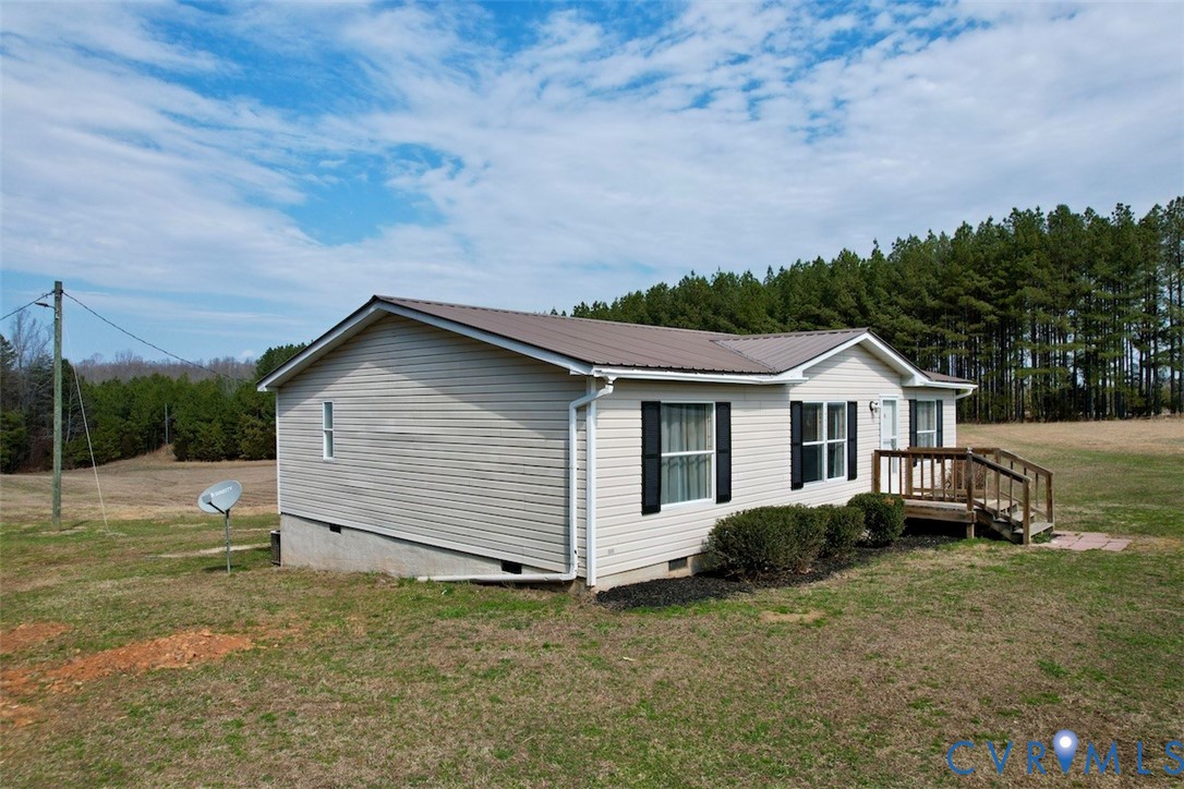 1225 Beech Forest Road Kenbridge, VA 23944 - Photo 4 of 33 a view of a house with a backyard