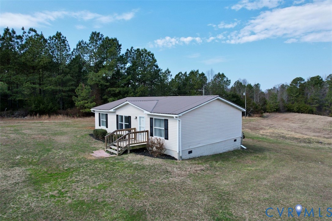 1225 Beech Forest Road Kenbridge, VA 23944 - Photo 5 of 33 an aerial view of a house with yard and large tree