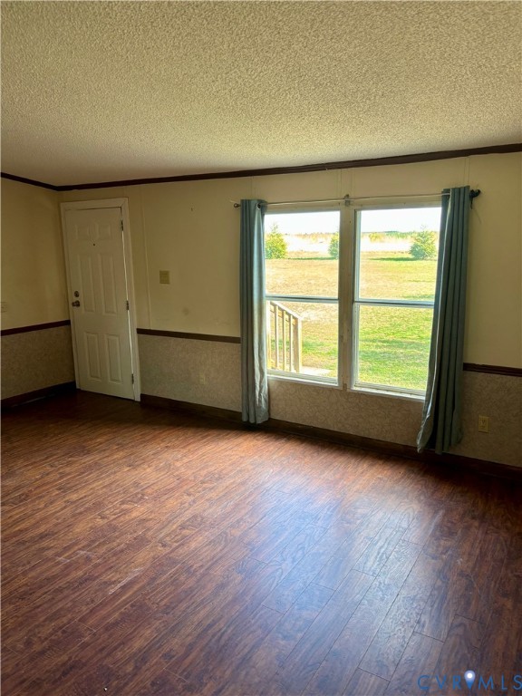 1225 Beech Forest Road Kenbridge, VA 23944 - Photo 9 of 33 an empty room with wooden floor and windows