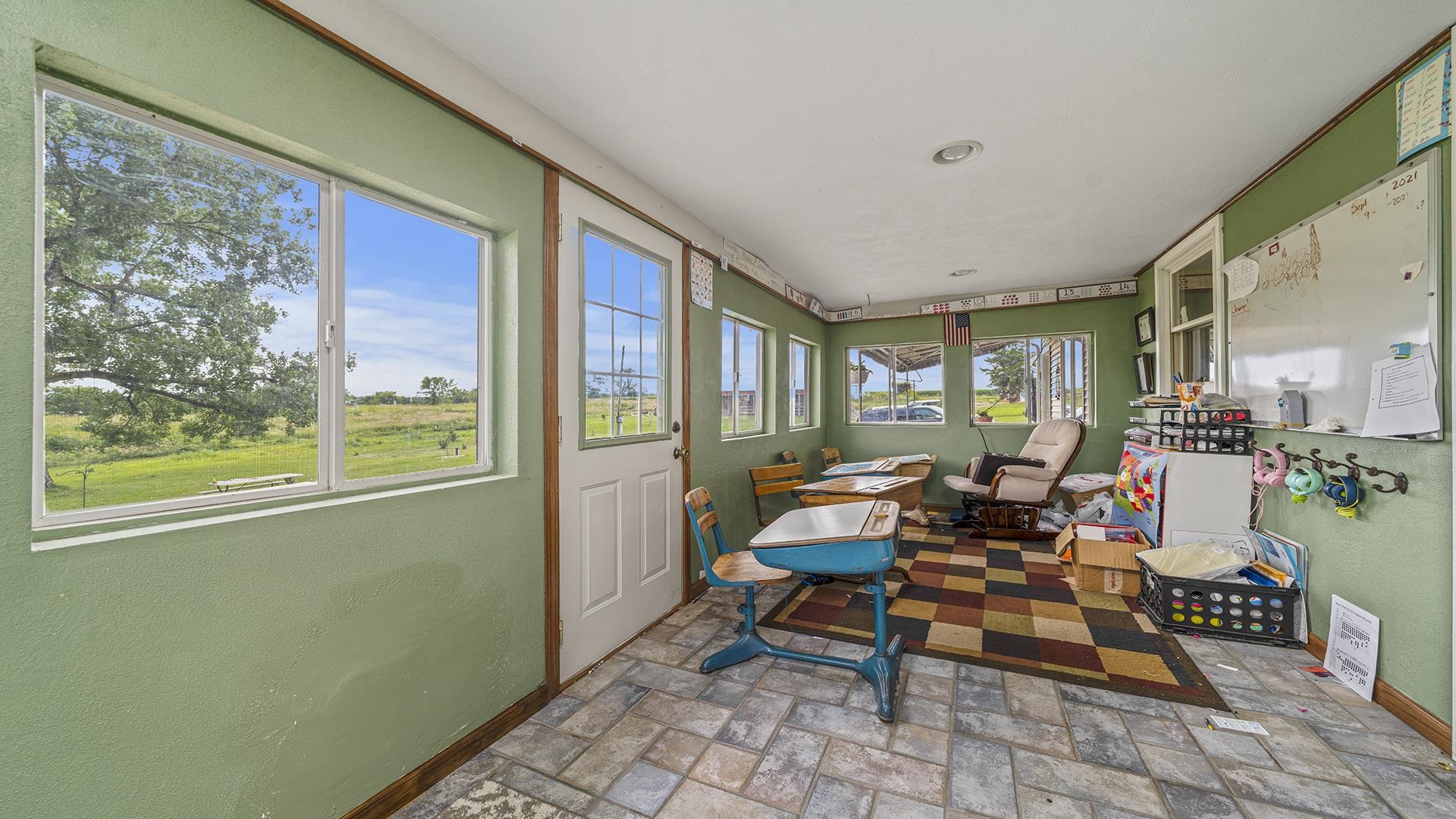 12112 North Hoisington Road Byron, IL 61010 - Photo 2 of 45 a outdoor space with lots of furniture and windows