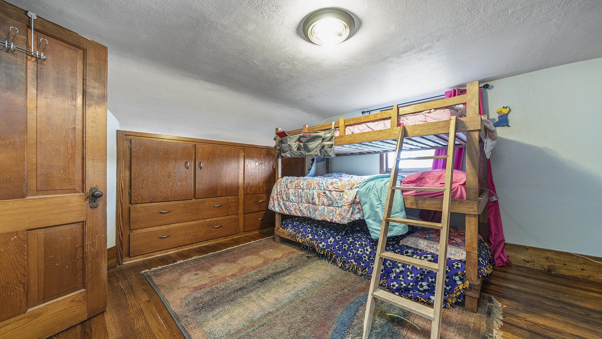 12112 North Hoisington Road Byron, IL 61010 - Photo 27 of 45 a bedroom with a bed and a window