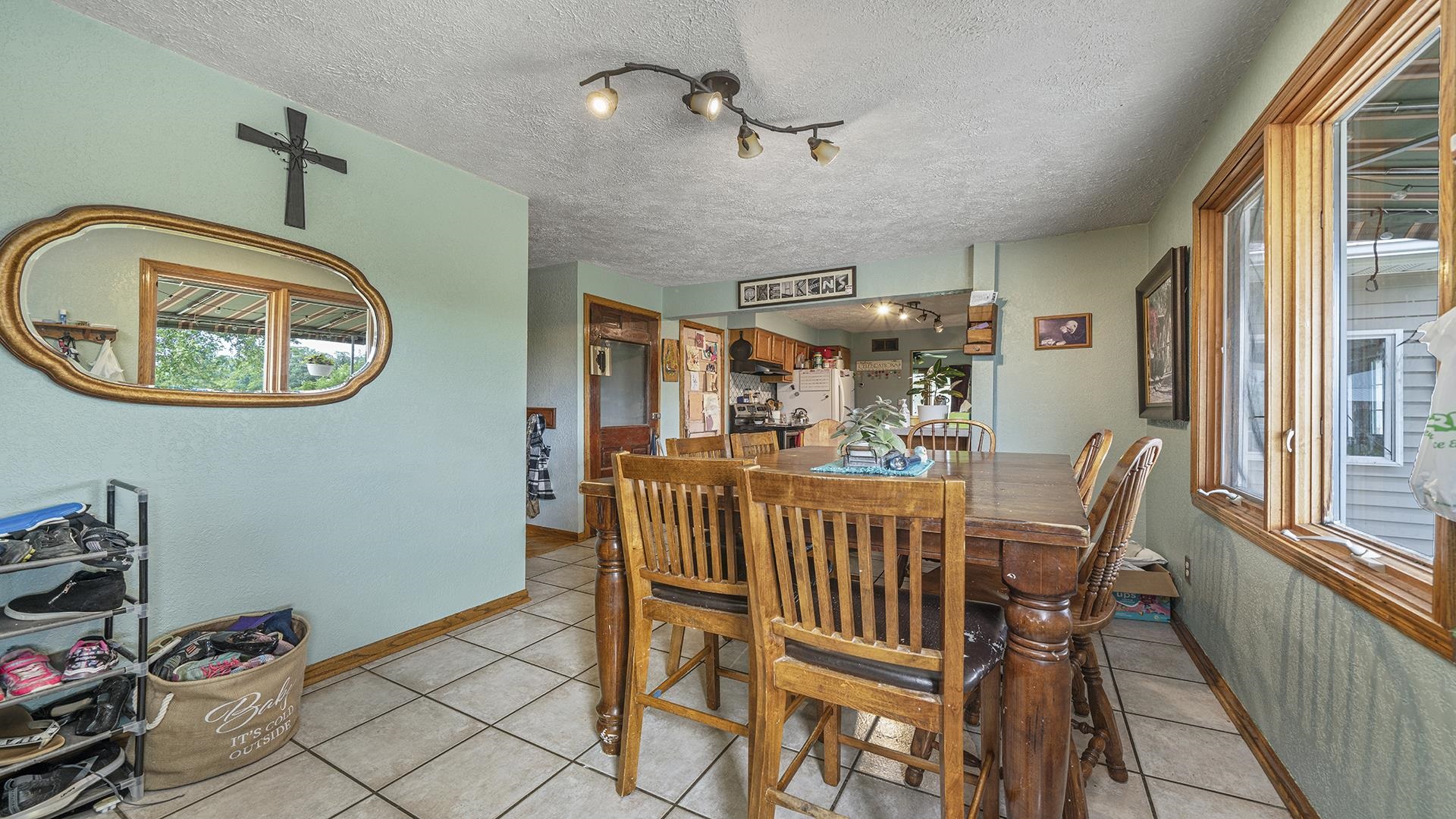 12112 North Hoisington Road Byron, IL 61010 - Photo 6 of 45 a view of a dining room with furniture window and outside view