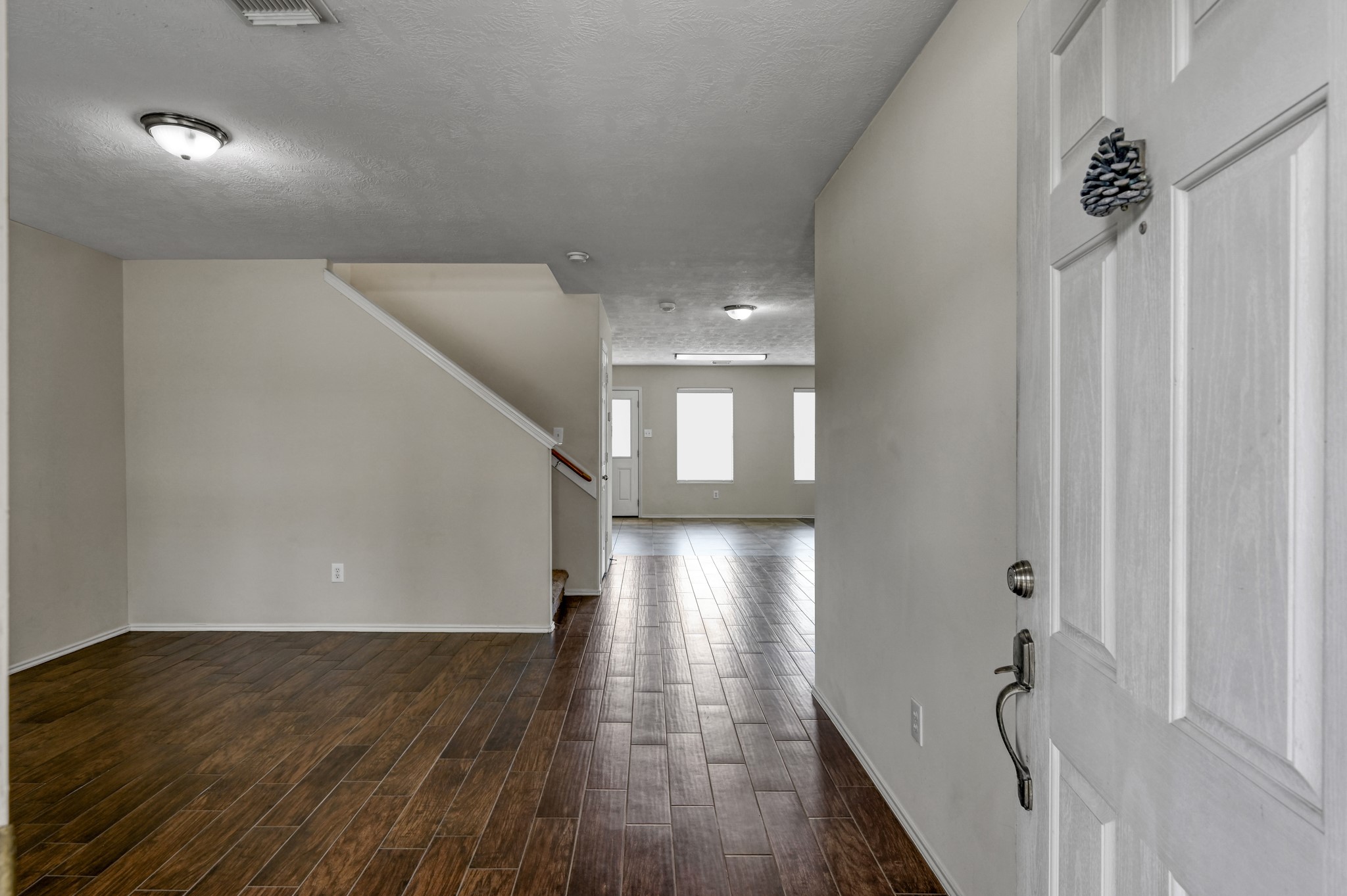 23919 Kingbriar Drive Spring, TX 77373 - Photo 4 of 33 Step inside to a welcoming entryway with durable wood-look tile flooring and a spacious, open feel.