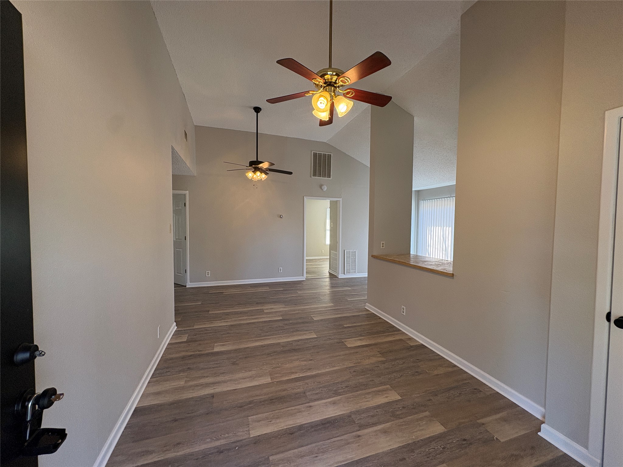 601 Valley Street San Marcos, TX 78666 - Photo 4 of 10 a view of an empty room with a window and wooden floor